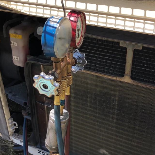 A/C manifold gauges in the workshop